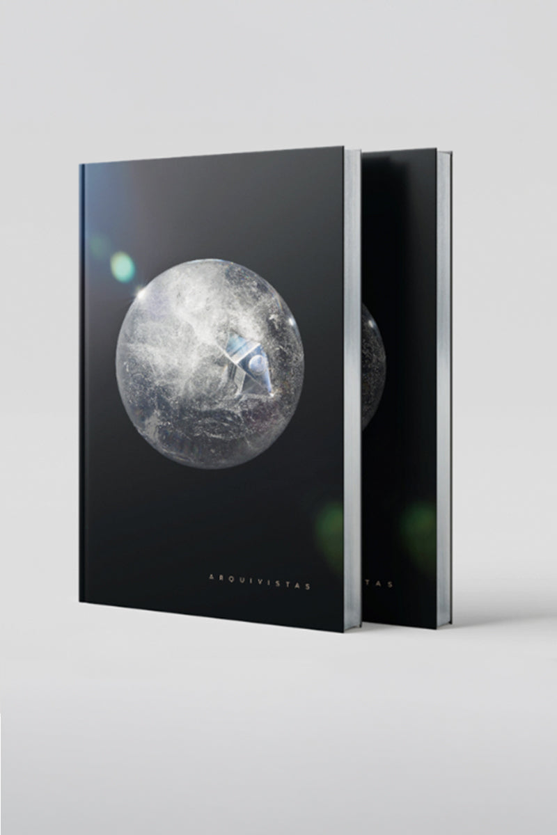 View of Arquivistas book front cover and silver guilded pages . Published by Art & Anthropology Press. Author, Tatiana Dorow. 