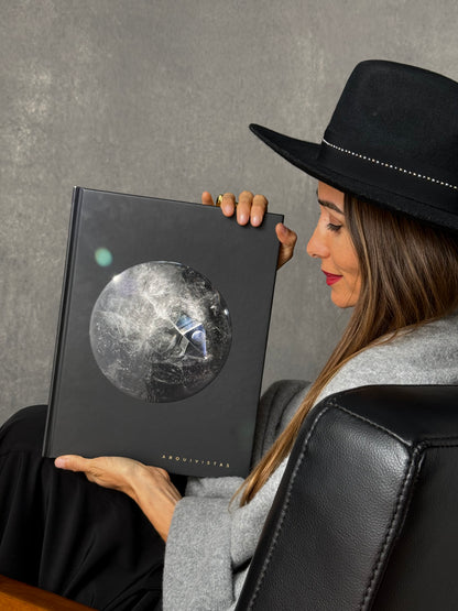Person holding Arquivistas for scale. Published by Art & Anthropology Press. Author Tatiana Dorow, Dorow Collection